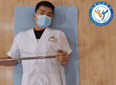 Supine cane-assisted shoulder external rotation